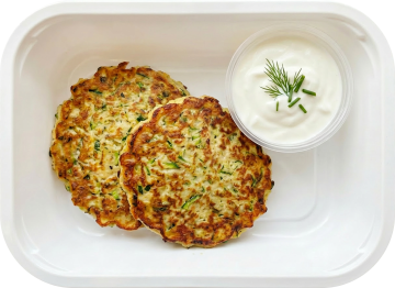 Chicken and zucchini pancakes with yogurt