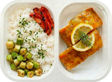 Baked lemon white fish with rice and vegetables